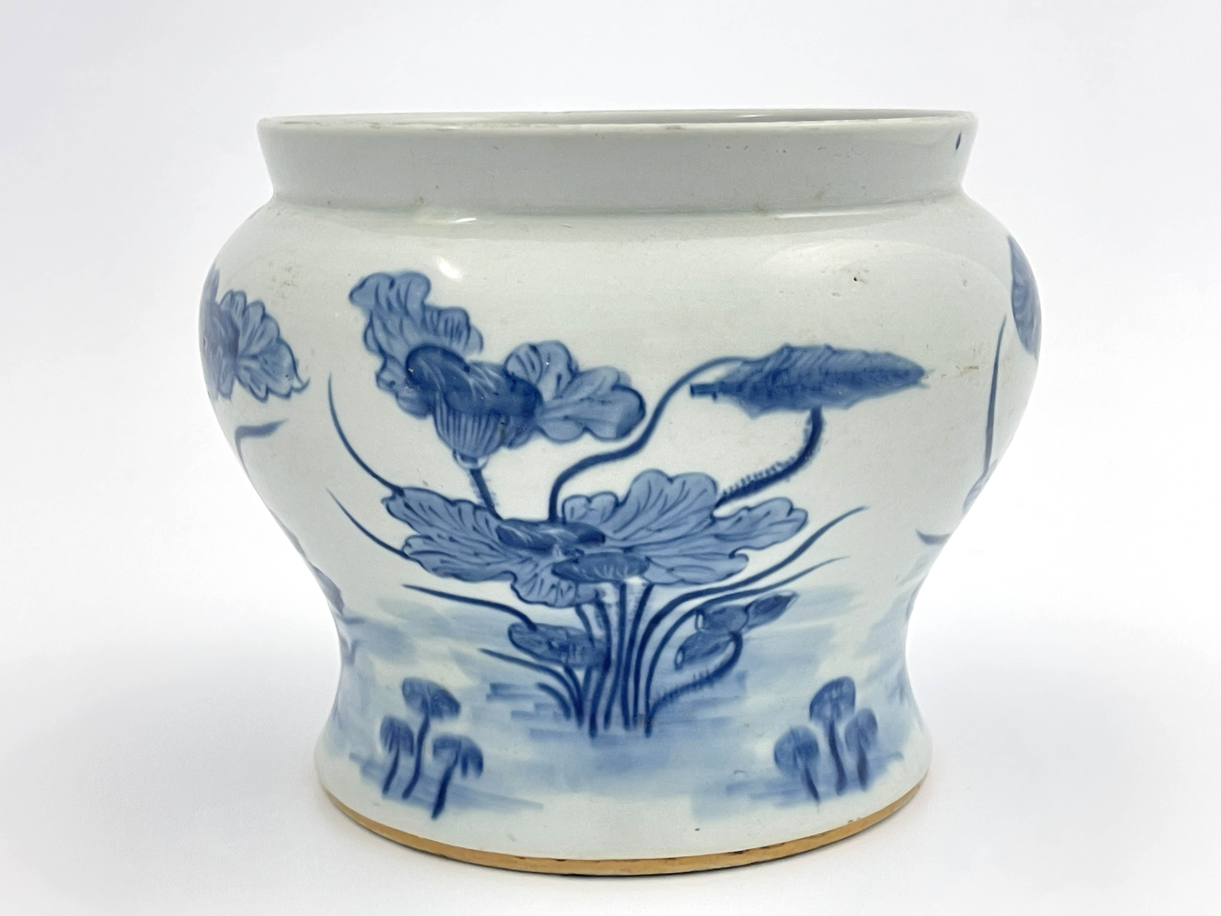 A 19th Century Chinese provincial blue and white jardiniere, of bombe form, painted with a frieze of