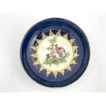 A Worcester blue ground/wet blue shallow dish, circa 1770s, decorated with fancy birds to the