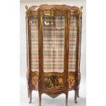 A kingwood vitrine of Louis XV design, of serpentine form with gilt metal mounts throughout,