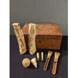 A 19th century leather box, 2 19th century Chinese bone carvings of gods, 2 19th century bone