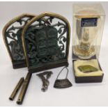 A collection of Jewish items to include a silver decanter label, a silver bracelet, mezuzahs,
