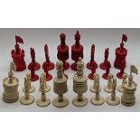 A Victorian chess set, red and white ivory, with box with label of W.Jenkins of Bristol, missing 1
