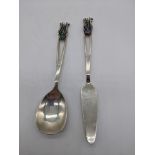 An Australian silver spoon and knife, stylised terminals mounted with stones, 42g, L.14.5cm