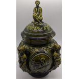 An 18th century French green ceramic tobacco pot and cover