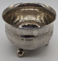 An Arts and Crafts Guild of Handicraft silver bowl, planished bowl, raised on 3 ball feet,