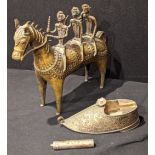 A bronze tribal study of 3 warriors on horseback, together with a white metal ashtray in the form of