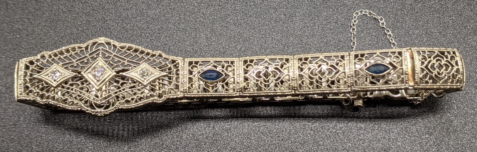 A 14ct white gold bracelet, mounted with 3 diamonds and 4 sapphires, 14g - Image 3 of 4