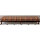 A large window seat, multicoloured patterned upholstery, 6 oak legs, H.43cm L.260cm D.47cm