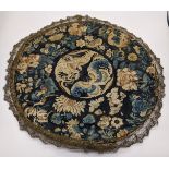 A Chinese mid 19th century circular silk embroidery depicting flora and fauna, D.30cm