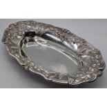 An Eastern silver dish, repousse embossed, 320g, L.29cm