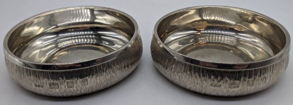 A pair of Gerald Benney silver coasters, bark effect finish, hallmarked London, 1971, 320g, H.3cm