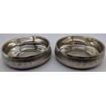 A pair of Gerald Benney silver coasters, bark effect finish, hallmarked London, 1971, 320g, H.3cm