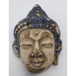 A late 18th/early 19th century Thai blue glazed Buddha head, H.6.5cm Provenance: Galerie Zache,