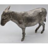 A silver cast sculpture of a donkey, hallmarked London 1964, maker Edward Barnard & Sons Ltd,