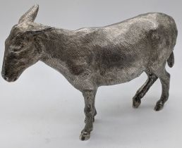 A silver cast sculpture of a donkey, hallmarked London 1964, maker Edward Barnard & Sons Ltd,