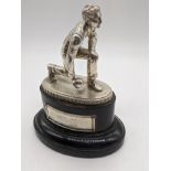 A silver bowling figure, mounted on wooded base, vacant plaque, H.16.5cm