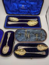 A pair of George IV silver tablespoons with etched designs, cased, together with a cased pair of