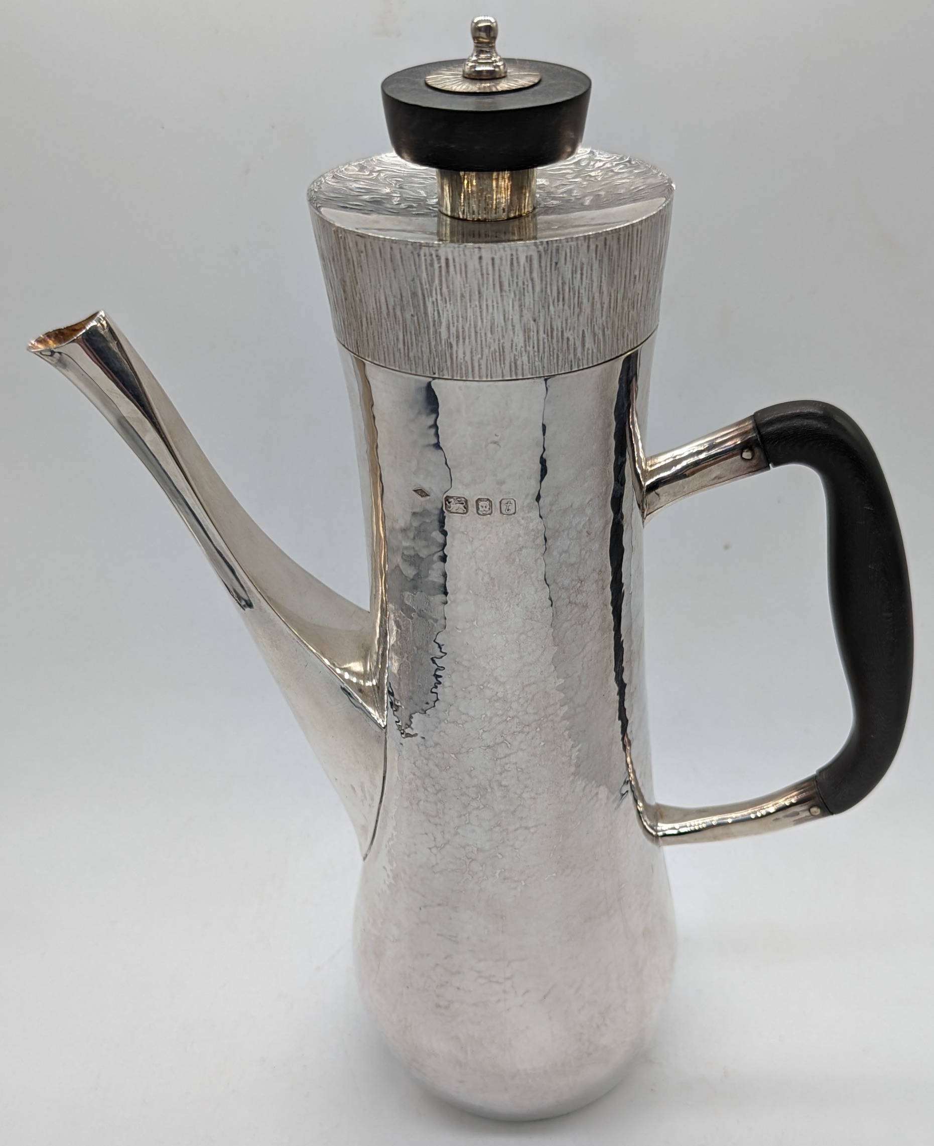 A Graham Watling silver coffee pot, planished finish, bark effect lid, wooden handles, hallmarked