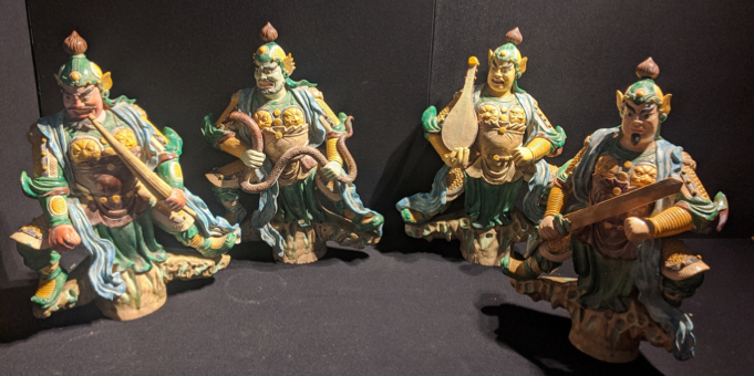 A late 19th/early 20th century Chinese set of four large sancai-glazed temple-roof figures depicting