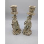 A pair of 19th century German porcelain candlesticks, H.19cm