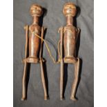 A pair of Indonesian ancestral puppet articulated figures, 20th century, Indonesia or Borneo, H.