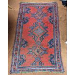 A red ground Persian rug