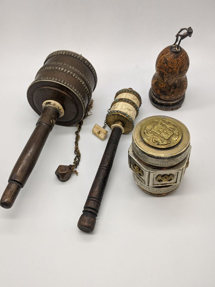 Four Chinese and Tibetan Buddhist prayer items to include 2 prayers wheels, a carved gourd etched