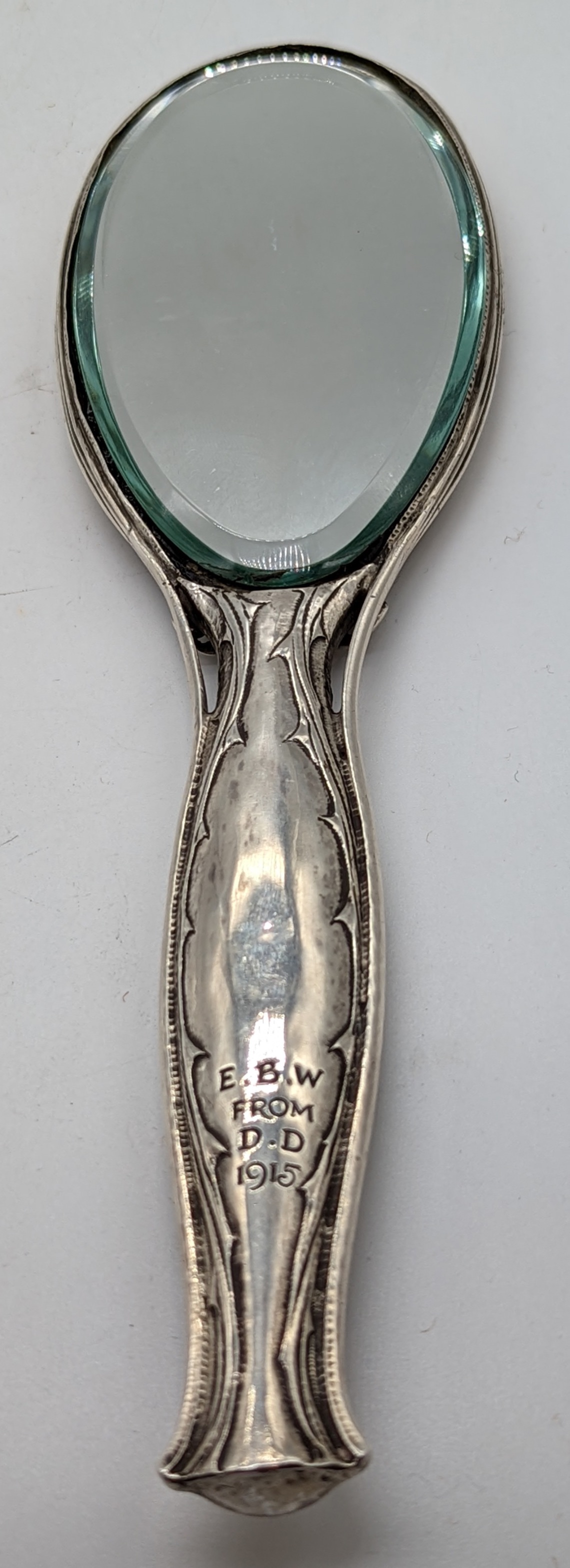 An Arts and Crafts Omar Ramsden & Alwyn Carr silver hand mirror, decorated with roses and thorns, - Image 2 of 3