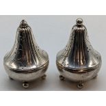 A pair of Georg Jensen silver peppers, raised on four ball feet, Danish marks to base, 50g, H.5cm