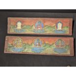 A pair of Tibetan or North Indian Buddhist manuscript covers, mounted with turquoise and coral,