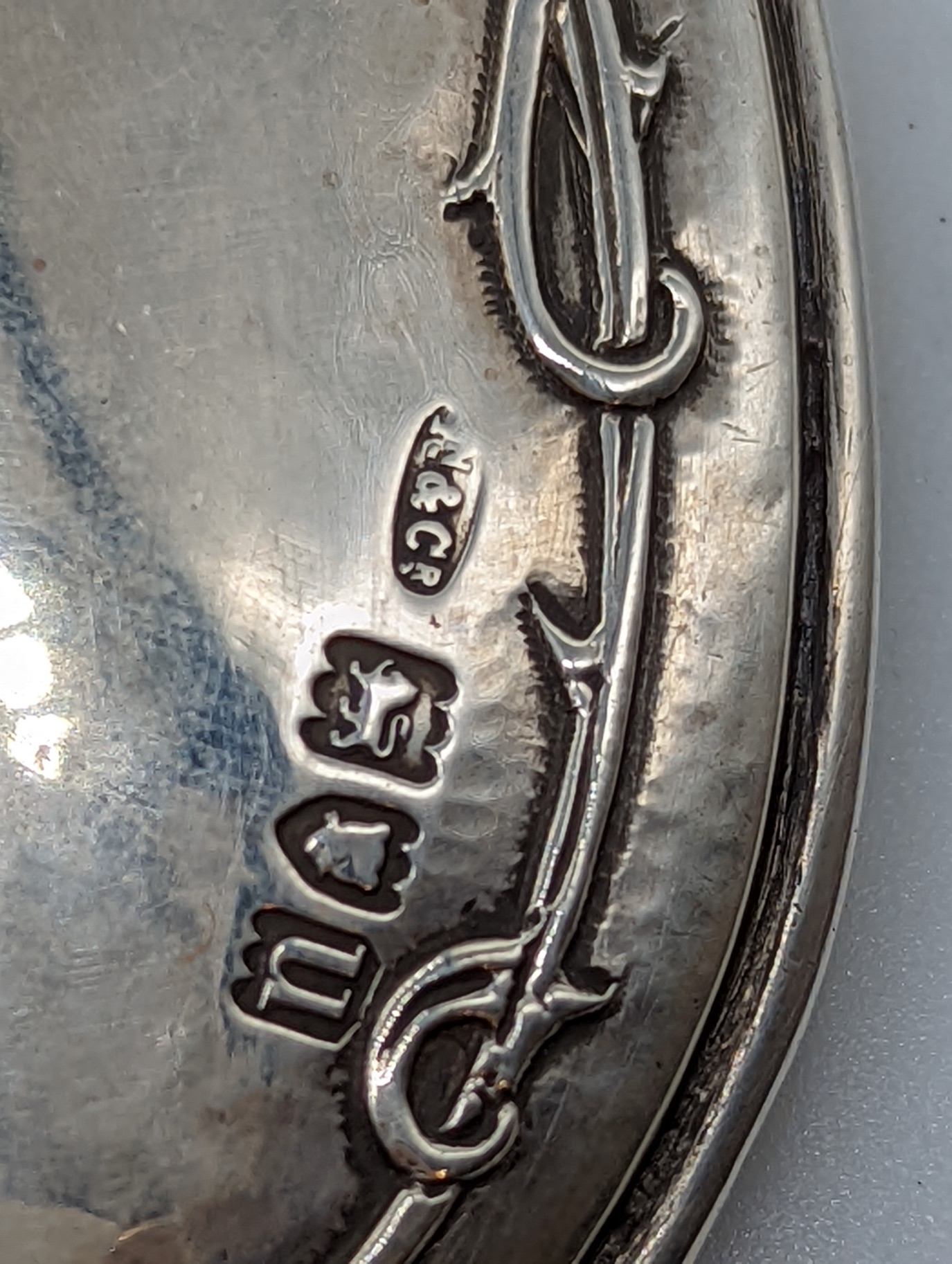 An Arts and Crafts Omar Ramsden & Alwyn Carr silver hand mirror, decorated with roses and thorns, - Image 3 of 3