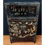 A Chinese black lacquered cabinet with inlaid figural decor, H.87cm W.56cm D.27cm