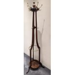 A mahogany and brass coat and hat stand