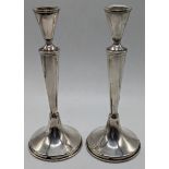 A pair of Continental silver candlesticks, marked 800, 325g, weighted bases, H.19cm