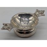 R.E.Stone silver tea strainer, crown handles, hallmarked London, 1936-37, 75g, D.11.5cm