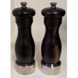 A pair of silver collared pepper and salt mills, Birmingham hallmarks, H.15cm