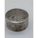 A 19th century Persian or Indian silver circular box with Islamic inscription, 92g, D.6.5cm
