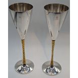 A pair of Stuart Devlin goblets, gilt stems, eagle crest to each, hallmarked London, 1978, 405g, H.