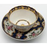 An 18th century Worcester cup and saucer, navy moon to base of both pieces