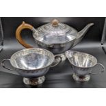 A William Hair Haseler for Liberty & Co. Arts and Crafts silver tea set, comprising of a teapot,