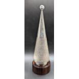 A Gerald Benney silver tennis trophy, cone shaped with tennis racquet emblem, bark effect finish,