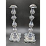 A pair of 20th century silver Sabbath candlesticks, indistinct London hallmarks, weighted bases,