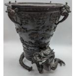 A Japanese Meiji period bronze jardiniere, the base in the form of a dragon, H.23.5cm