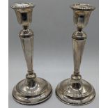 A pair of Continental silver candlesticks, marked 800, 325g, weighted bases, H.19cm