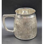 A Modernist silver mug, bark effect finish, hallmarked London, 1970, 230g, H.8.5cm