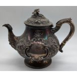 A Victorian silver teapot, repousse embossed, hallmarked London, 1864, maker Daniel & Charles Houle,