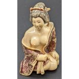 A Japanese Meiji period ivory netsuke of a semi nude lady, signed to base, H.5.5cm