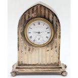 An early 20th century silver mantel clock, Swiss made clock with Roman numerals and subsidiary dial,