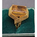 An 18ct gold and citrine ring, rope style mount, indistinct mark, stone size 1.5cm x 1.3cm, 15g,