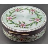 An Asprey silver and enamel circular box, light green guilloche enamel with pink flowers, gilt